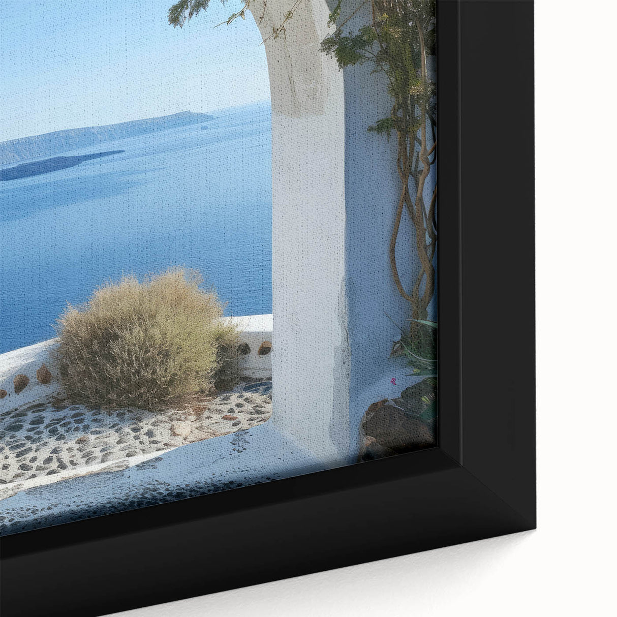 Close-up of a black wall art piece featuring a textured, colorful abstract design on a framed canvas.