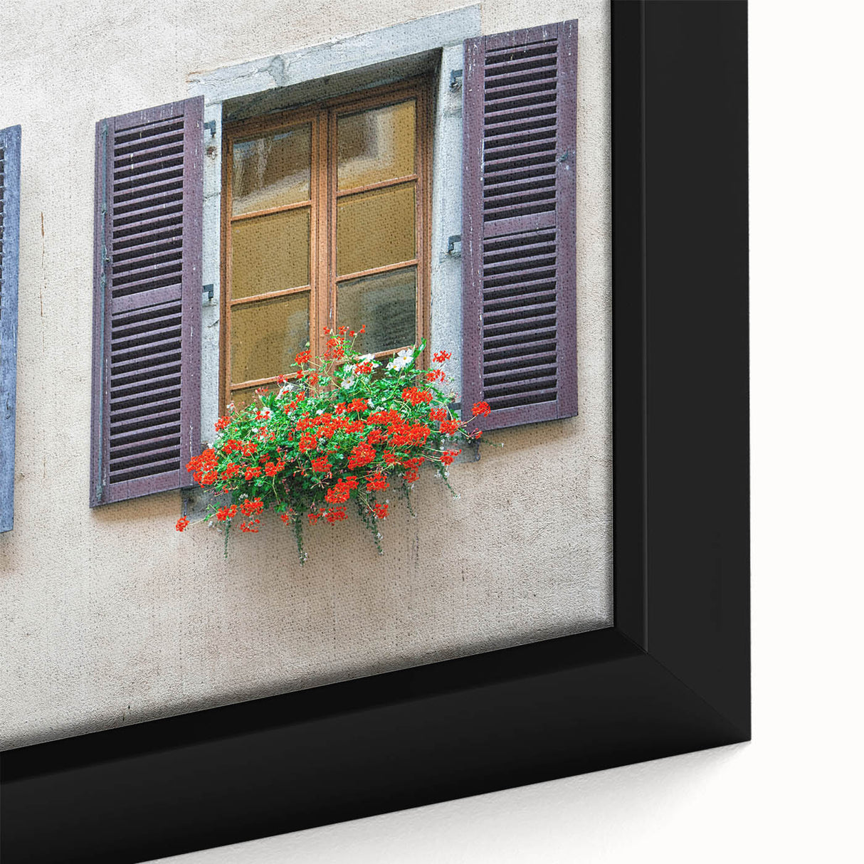 Close-up of a black framed canvas featuring a colorful, textured depiction of architectural windows.