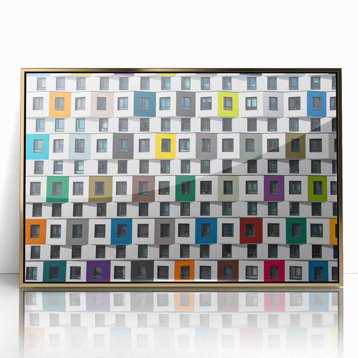 Mid-century modernist art depicting geometric shapes in gold and black on a framed acrylic print.