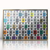 Mid-century modernist art depicting geometric shapes in gold and black on a framed acrylic print.