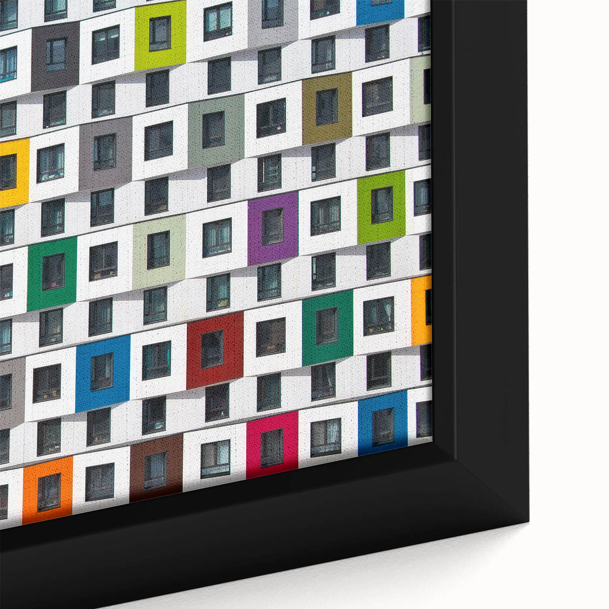 Close-up of a black framed canvas featuring a textured, colorful abstract design, ideal for living room decor.