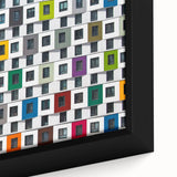 Close-up of a black framed canvas featuring a textured, colorful abstract design, ideal for living room decor.