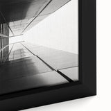 Close-up of a black framed canvas featuring a colorful, textured abstract window design, ideal for living room decor.