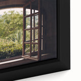 Close-up of black wall art featuring a textured, colorful abstract design on a framed canvas.