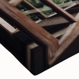 Large art of a black and white landscape painting on stretched canvas, featuring an architectural window design.