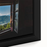 Close-up of extra large black wall art featuring a colorful, textured window design on a framed canvas.