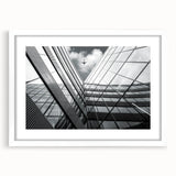 Extra large abstract art print featuring textured swirls in muted gray and blue tones, framed with a white mat.