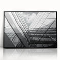 Framed acrylic print of large abstract wall art featuring geometric shapes in black and gray.