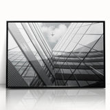 Framed acrylic print of large abstract wall art featuring geometric shapes in black and gray.
