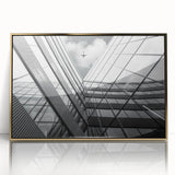 Mid-century modernist abstract architecture in gold and white acrylic, framed, suitable for modern art wall decor.