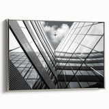 Vintage poster art on framed canvas featuring abstract architecture in black with colorful accents.