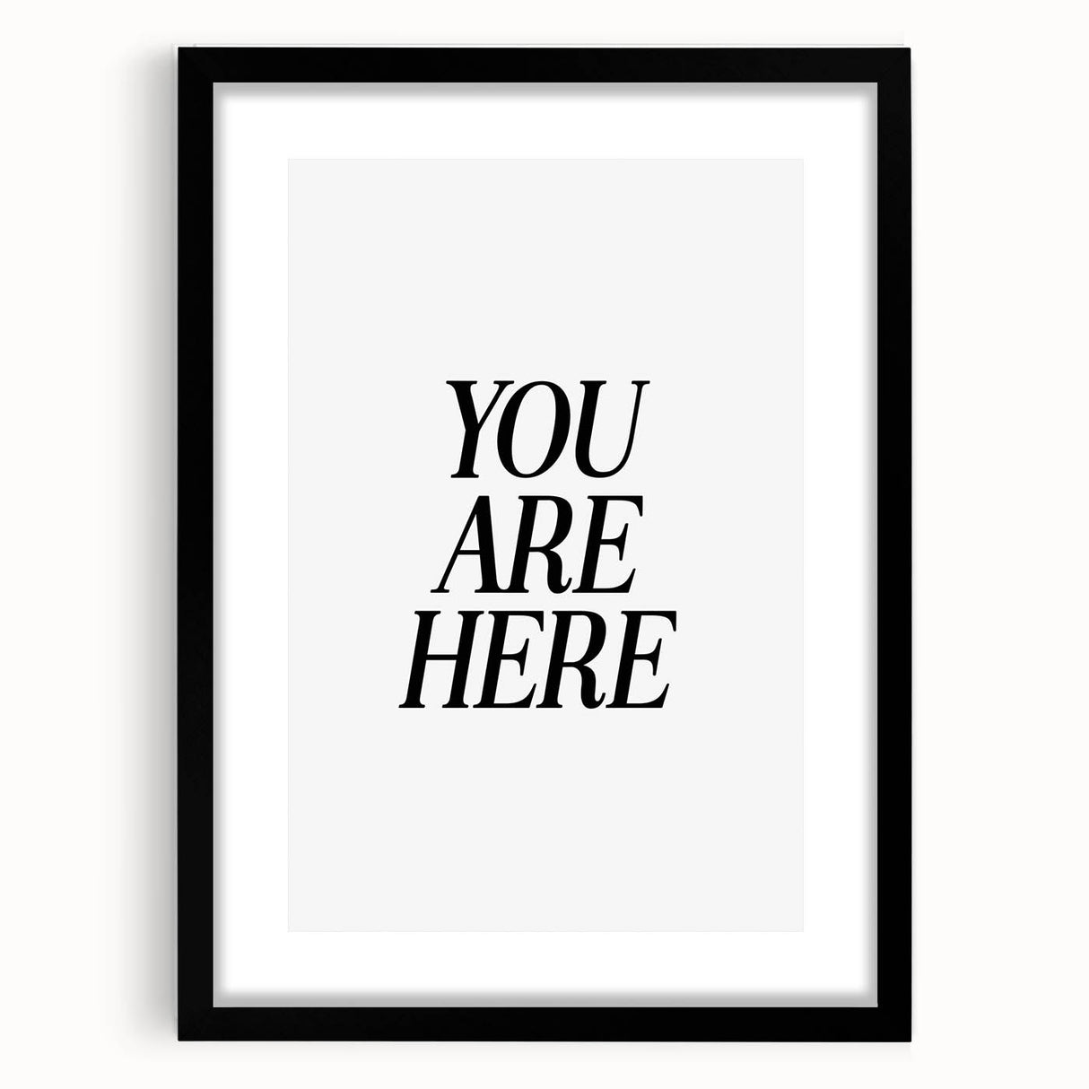 Electric Wall Art: Bold Black Typography 'You Are Here' for Modern Spaces