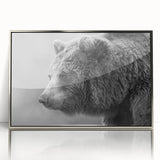 Framed wall art featuring a striking black bear design with a sleek silver frame and acrylic front, ideal for nature-themed decor in modern interiors.