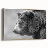 Framed wall art featuring a striking black bear design on canvas, highlighted with a gold frame, showcasing intricate details and a sleek side view. Perfect for wildlife enthusiasts and nature-inspired decor.