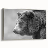 Framed canvas wall art featuring a striking black bear design, presented with a sleek silver frame, showcasing a side view that highlights its artistic details and vibrant colors. Perfect for nature lovers and home decor enthusiasts seeking wildlife-inspired artwork.