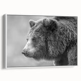 Framed wall art featuring a striking black bear design on a textured canvas, displayed from a side view against a white background, ideal for nature-themed decor.