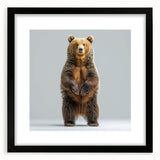 Framed black bear wall art in a sleek black frame with a white mat, showcasing a detailed design perfect for nature-themed decor in modern interiors.