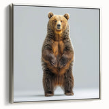 Framed wall art featuring a black bear design on canvas, showcasing intricate details and a silver frame, ideal for nature-themed home decor.