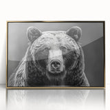 Framed wall art showcasing a striking black bear design with gold accents, presented in an acrylic frame to enhance its visual appeal and protect the artwork.