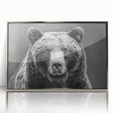 Framed wall art featuring a striking black bear design with an acrylic finish, showcased in a sleek silver frame, ideal for nature-themed home decor.