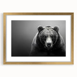 Framed wall art showcasing a striking black bear design with a gold mat, perfect for adding a touch of nature-inspired elegance to any home decor.