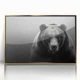 Framed wall art featuring a striking black bear design, set in a sleek gold-acrylic frame, perfect for wildlife enthusiasts and modern decor.