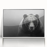 Framed wall art featuring a striking black bear design with a white border, displayed in an elegant acrylic frame, perfect for nature enthusiasts and home decor lovers.