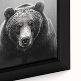 Close-up view of a framed black bear wall art piece, showcasing intricate details and textures, perfect for nature-themed home decor. This vibrant canvas captures the essence of wildlife and adds a striking focal point to any room.