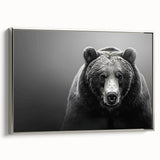 Framed wall art featuring a black bear design on textured canvas, showcasing intricate details and a silver frame, ideal for nature-themed home decor.