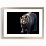 Framed wall art featuring a detailed black bear design in a silver frame with a white mat, showcasing wildlife artistry ideal for home decor enthusiasts.