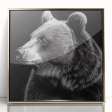 Framed wall art featuring a black bear design with gold accents, displayed in an elegant acrylic frame, perfect for enhancing home decor.