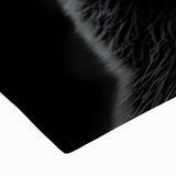 Close-up of a stretched canvas featuring a black bear design, showcasing intricate details and textures, perfect for wildlife-themed home decor.