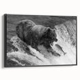 Framed wall art featuring a black bear design on textured canvas, showcasing side view details with a sleek black frame, perfect for nature-themed decor.