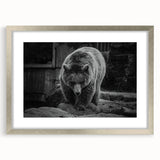 Framed wall art featuring a captivating black bear design with a sleek silver mat, showcasing intricate details and a modern aesthetic, perfect for nature lovers.