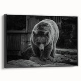 Framed wall art showcasing a striking black bear design on canvas, featuring a sleek black frame and side view display, perfect for nature-themed decor.