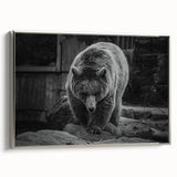 Framed wall art showcasing a striking black bear design on textured canvas, featuring a sleek silver frame, adding an elegant touch to any home decor.