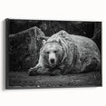 Framed canvas wall art showcasing a striking black bear design, elegantly displayed in a modern black frame, perfect for nature-themed decor.
