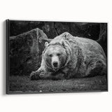 Framed canvas wall art showcasing a striking black bear design, elegantly displayed in a modern black frame, perfect for nature-themed decor.