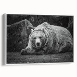 Framed black bear wall art on a white canvas, showcasing a detailed design of the bear in a natural pose, perfect for nature-themed decor.