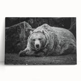 Black bear wall art stretched canvas featuring a minimalist design, leaning against a neutral wall, perfect for nature-themed home decor. Ideal for wildlife enthusiasts.