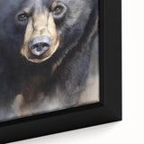 Close-up of a framed black bear wall art piece, showcasing intricate details and textures of the bear's fur against a natural backdrop, ideal for wildlife enthusiasts.