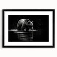 Black bear wall art framed with a mat, showcasing a striking design in a sleek black frame. Perfect for nature enthusiasts and home decor.