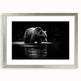 Framed wall art featuring a striking black bear design, set against a silver mat, showcasing intricate details and textures. Perfect for nature-themed decor.
