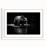Black bear wall art framed with a white mat, showcasing a detailed illustration of a bear in a natural setting, perfect for cabin or nature-themed decor.