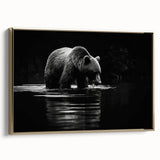 Framed wall art featuring a striking black bear design on canvas, showcased from the side with a gold frame, ideal for nature-themed home decor.