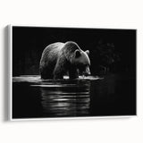 Framed wall art featuring a striking black bear design on canvas, elegantly displayed with a white frame, showcasing the bear's intricate details and natural colors. Perfect for wildlife enthusiasts and home decor lovers.