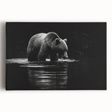 Black bear wall art design on stretched canvas, showcasing detailed fur texture and striking colors, perfect for nature-themed home decor or wildlife enthusiasts.