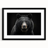 Framed wall art featuring a striking black bear design with a sleek black mat, perfect for enhancing modern home decor and nature-themed interiors.