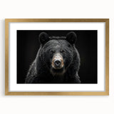 Black bear wall art framed in gold with a mat, showcasing a detailed design of a bear in a natural setting, perfect for home decor enthusiasts.