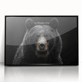 Framed wall art featuring a striking black bear design, showcasing intricate details and a sleek acrylic finish, perfect for nature enthusiasts and modern decor.